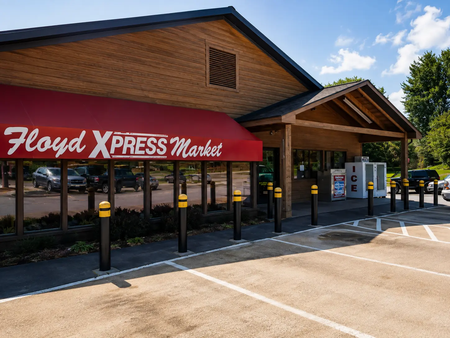 Floyd, VA convenience store with wood exterior, spacious parking, and protective bollards