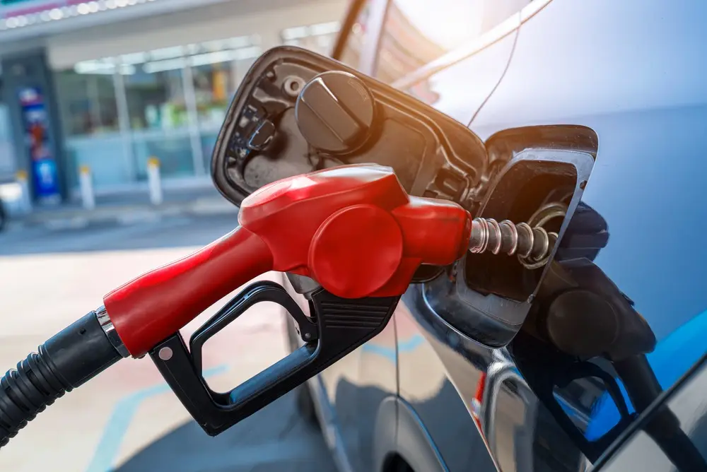 Red fuel pump filling a vehicle with gasoline in Floyd, VA