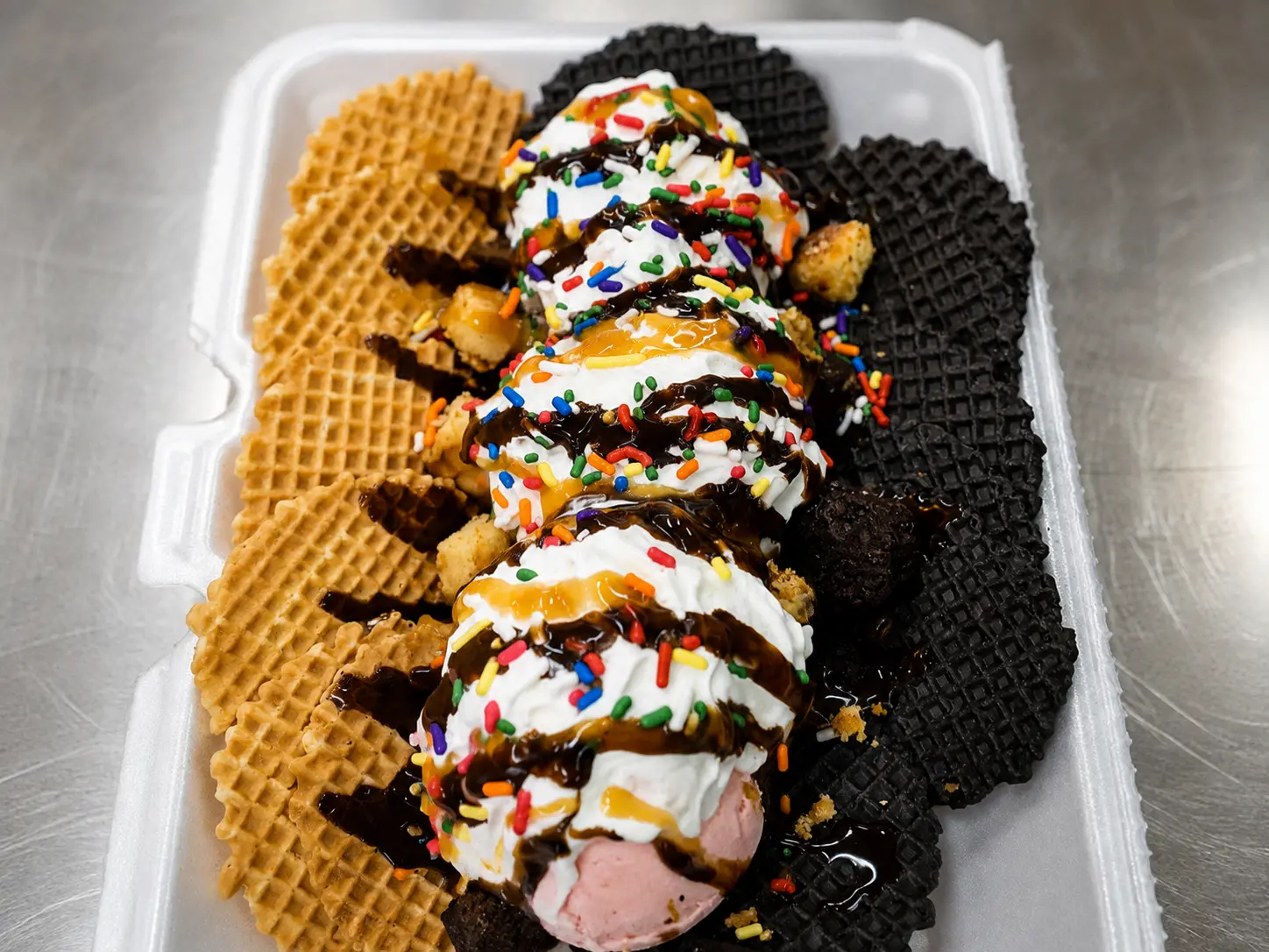 Strawberry ice cream with whipped cream, chocolate and caramel syrup, and sprinkles on assorted biscuits at Floyd Xpress Market in Floyd, VA