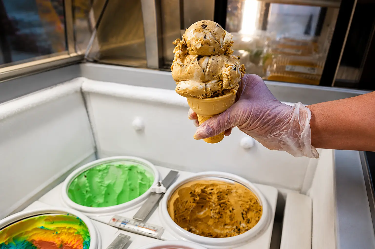 Cookie dough ice cream scooped into a cone by a gloved server at Floyd Xpress Market in Floyd, VA