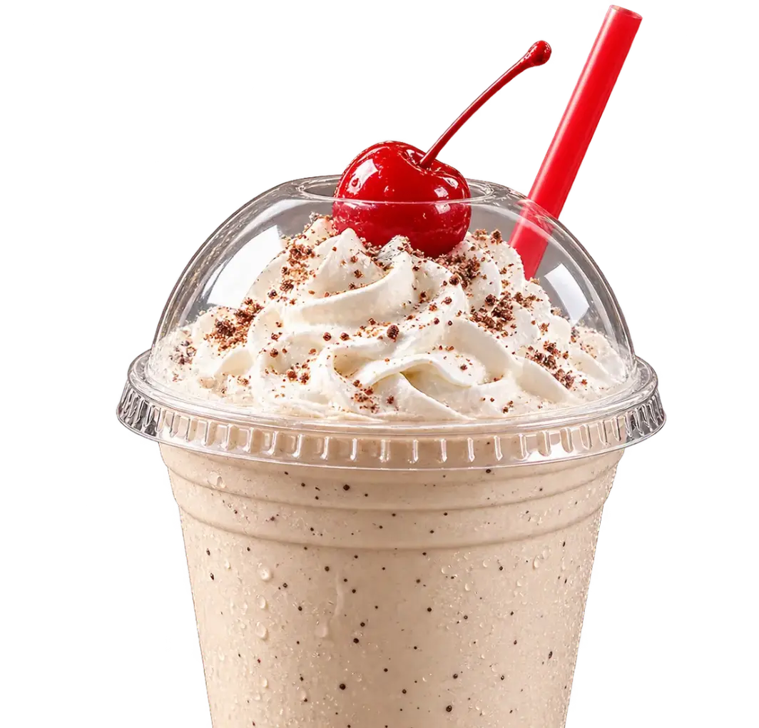 Hand-dipped milkshake with powdered topping, cherry, and straw at Floyd Xpress Market